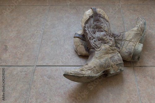 Muddy cowboy boots