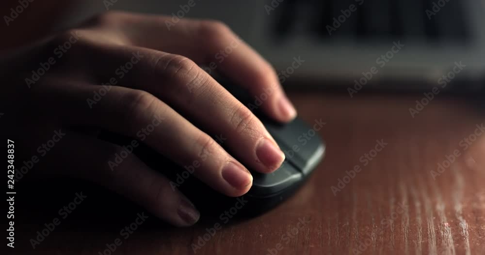 Close up view of woman hand use mouse at night. 4K Footage - Video