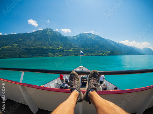 POV travelling by boat at Brienz lake at summer time in Switzerland.