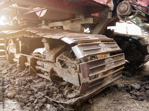 Close-up of Crawler tracks combine harvesters of The machine for harvesting from the fields.