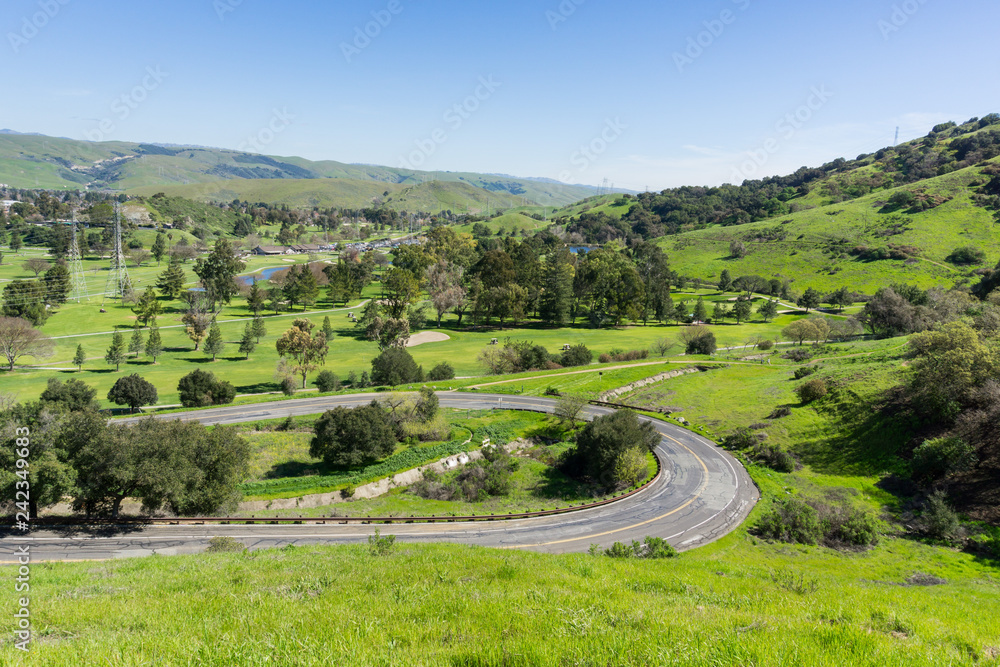 Golf course and winding road, California