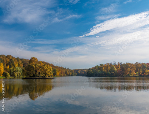 Autumn foliage with water reflection natural landscape © Arrows