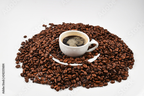 Cup of coffee and coffee beans.