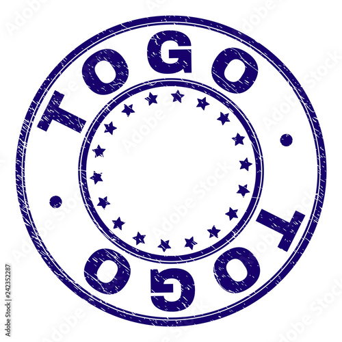 TOGO stamp seal watermark with distress texture. Designed with round shapes and stars. Blue vector rubber print of TOGO title with scratched texture.