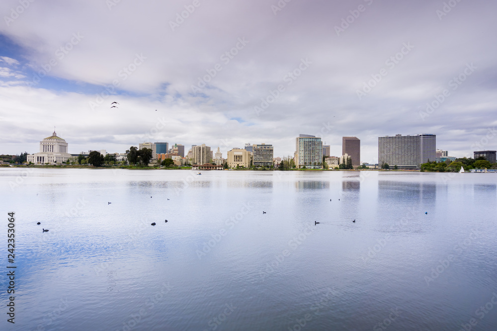 Downtown Oakland as seen from across Lake Merritt on a cloudy spring day, San Francisco bay area, California Downtown Oakland as seen from across Lake Merritt on a cloudy spring day, San Francisco bay area, California