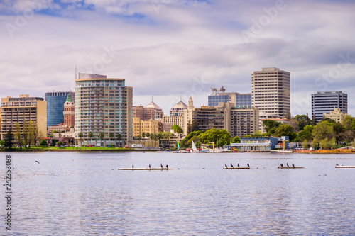 Fototapeta Naklejka Na Ścianę i Meble -  Downtown Oakland as seen from across Lake Merritt on a cloudy spring day, San Francisco bay area, California