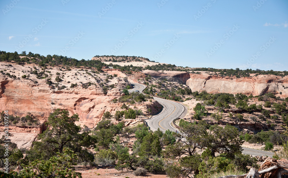 Road uphill with many bends in American desert mountains