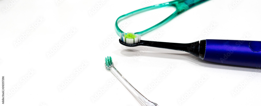 Closeup, flat lay composition with toothbrushes, tongue cleaner on white background, Closeup, flat lay composition with toothbrushes, tongue cleaner on white background,