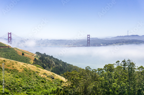 Golden Gate and the San Francisco bay covered by fog, as seen from the Marin Headlands State Park, California