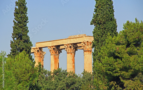 The huge archeological column ruins of the Temple of Olymian Zaus in Athens, Greece with blue sky copy space.