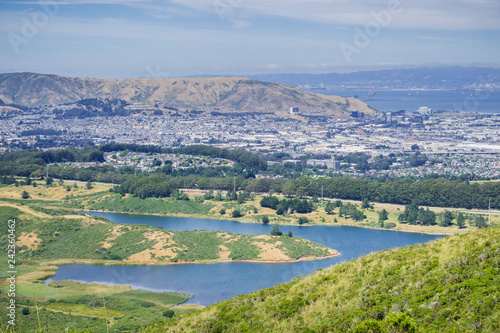 San Andreas reservoir and the town of South San Francisco, the Industrial city, in the background  San Francisco bay, California © Sundry Photography
