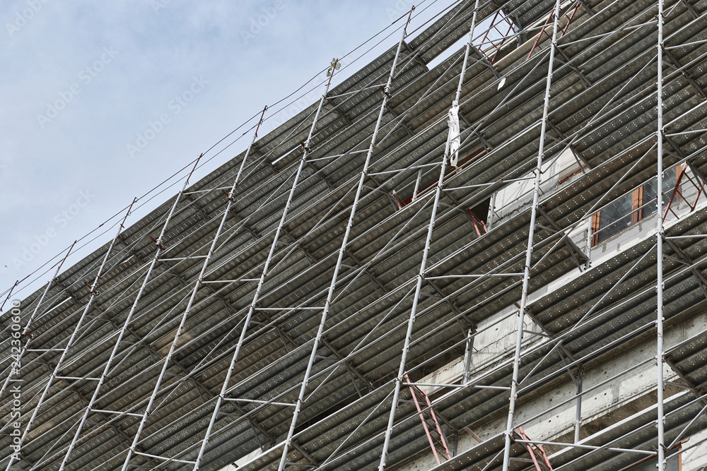 new building under construction, scaffolding and concrete