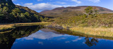 Scenic lakes of Killarney national park, landscape reflected in still water, Ring of Kerry, Ireland.
