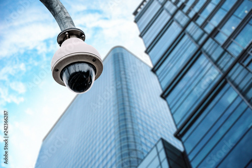 Photography Security camera with a glass building on the background