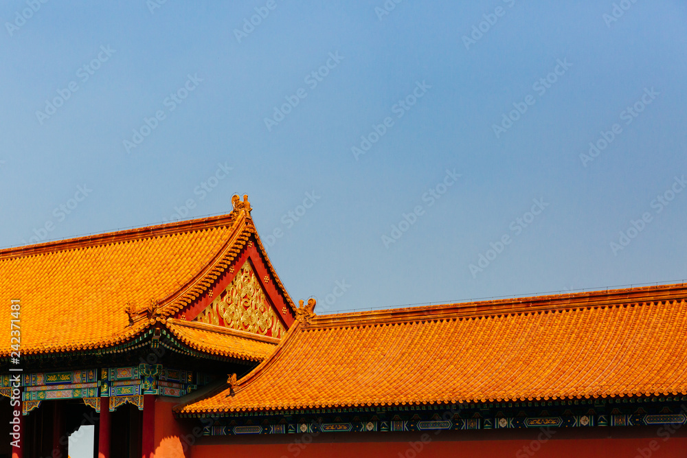 Traditional Chinese architecture with yellow roof tiles, in Forbidden City, under blue sky, in Beijing, China Traditional Chinese architecture with yellow roof tiles, in Forbidden City, under blue sky, in Beijing, China