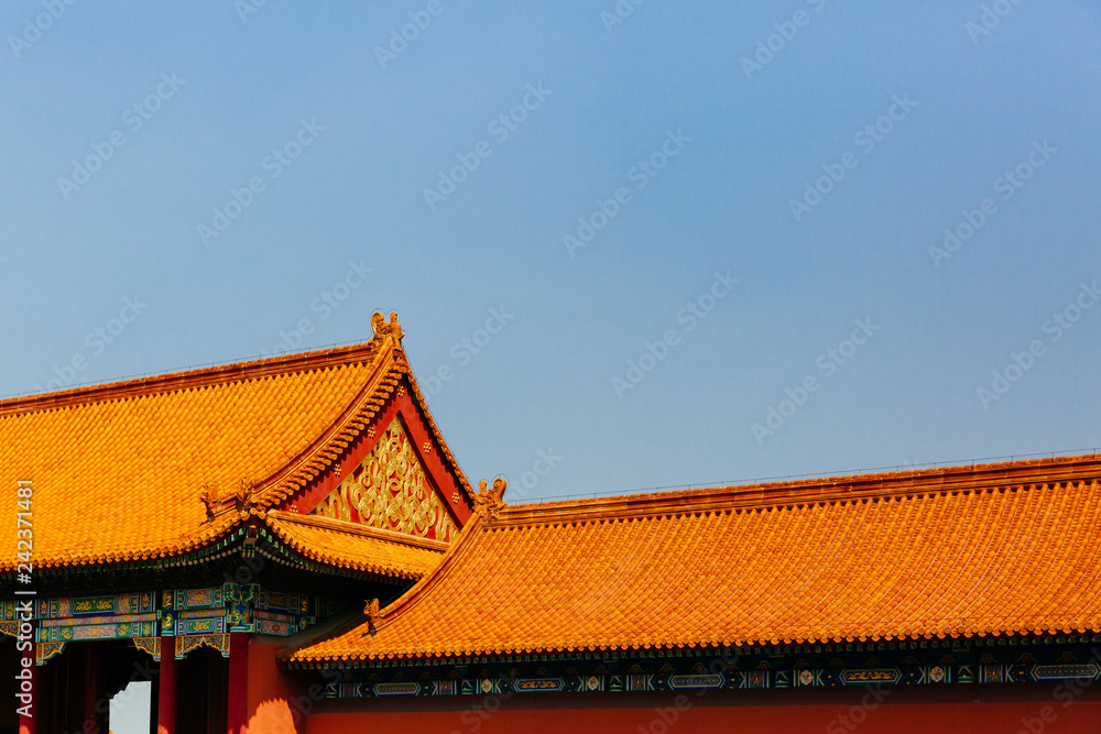 Traditional Chinese architecture with yellow roof tiles, in Forbidden City, under blue sky, in Beijing, China