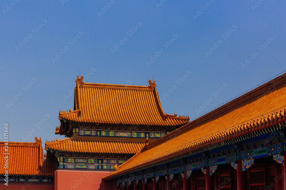 Traditional Chinese architecture with yellow roof tiles, in Forbidden City, under blue sky, in Beijing, China Traditional Chinese architecture with yellow roof tiles, in Forbidden City, under blue sky, in Beijing, China