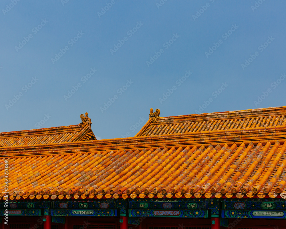 Traditional Chinese architecture with yellow roof tiles, in Forbidden City, under blue sky, in Beijing, China
