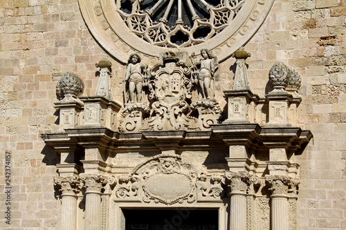 Cattedrale di Otranto; coronamento del portale con statue e stemma vescovile photo