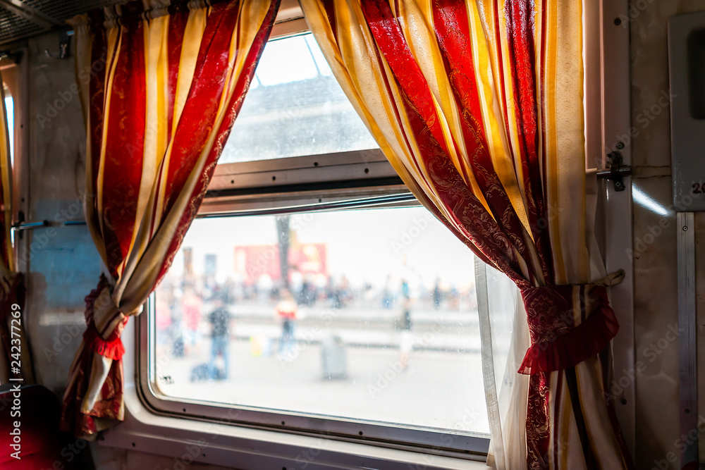 Lviv, Ukraine interior inside window architecture of Lvov or Lwow train  station platform with crowd of people in background and Ukrainian design  with red old vintage Soviet curtains Stock Photo | Adobe