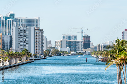 Hollywood Miami Florida beach cityscape skyline of residential skyscrapers coastal buildings condo apartments, high angle aerial view of Stranahan River and construction photo