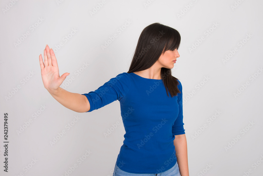 Pretty girl young woman hand stop sign body language enough concept in ...