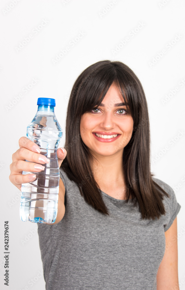 beautiful young girl holding bottle of water beautiful young girl holding bottle of water
