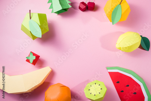 exotic fruits made of paper on pink background © EkaterinaVladimirova