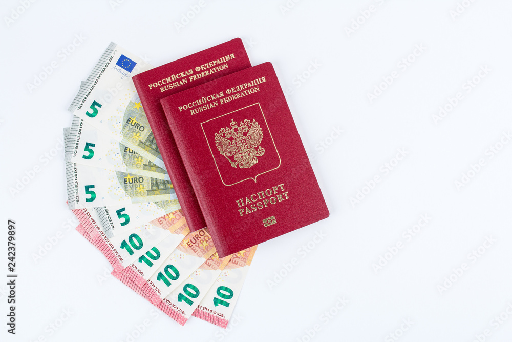 Passports and Euro banknotes on white background top view