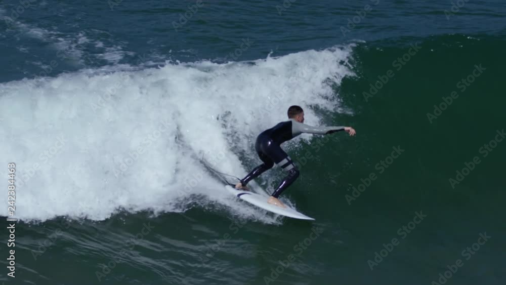 Surfer Rides A Wave, Practices A Trick In The Air, Slow Motion Surfer Rides A Wave, Practices A Trick In The Air, Slow Motion