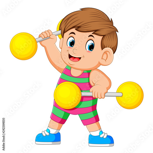 the boy playing and holding up the yellow barbells
