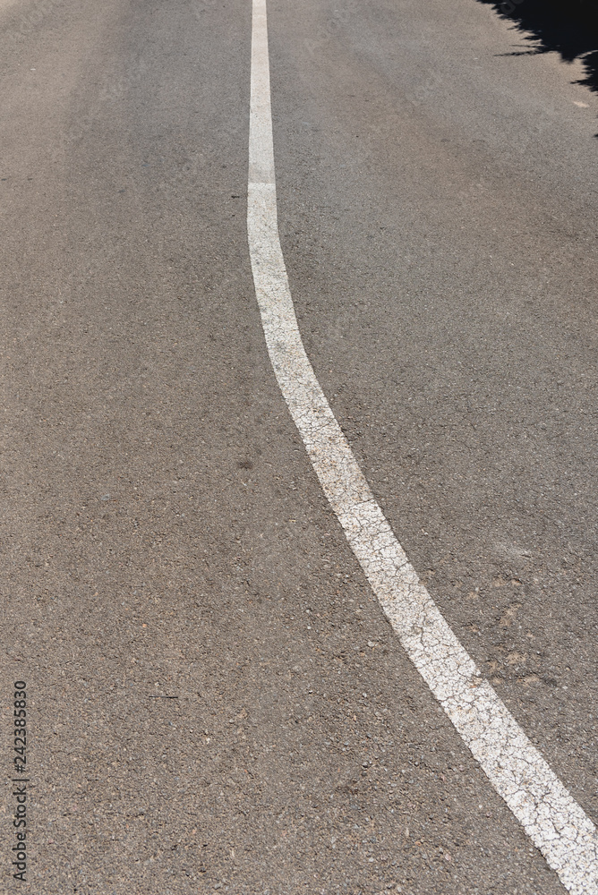 White direction road lines with black background and space for text. White direction road lines with black background and space for text.