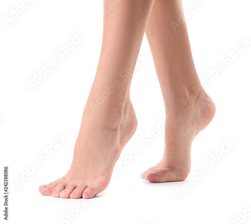 Woman with smooth feet on white background, closeup. Spa treatment