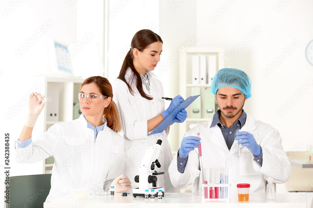 Scientists working in laboratory. Research and analysis Scientists working in laboratory. Research and analysis