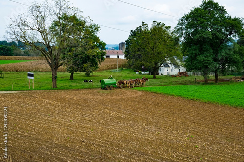 Amish Farmer Filling up Liquid Manure Tank photo