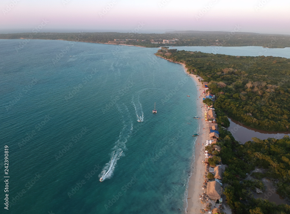 Aerial drone view photo of tropical caribbean beach. flight over white sand beach and beautiful turquoise and sapphire clear sea