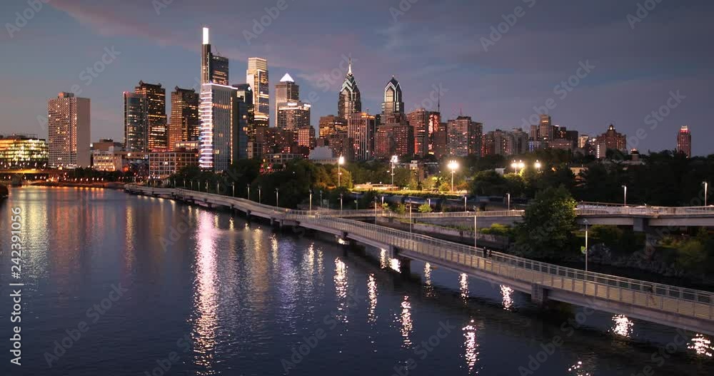 Downtown city skyline view of Philadelphia Pennsylvania over the Schuylkill River and boardwalk Downtown city skyline view of Philadelphia Pennsylvania over the Schuylkill River and boardwalk