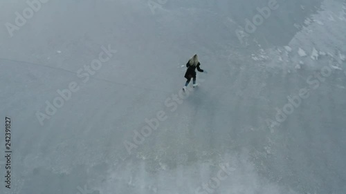 Ice Skating on a frozen lake photo