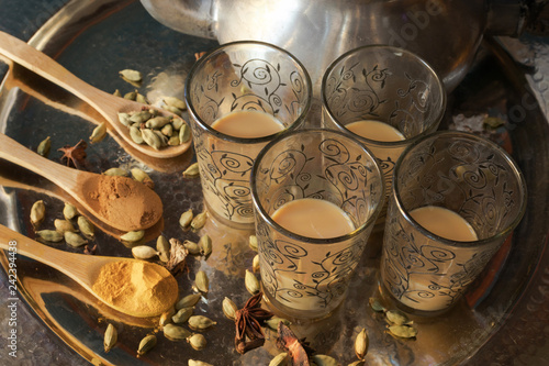 glass cups of pakistani tea with spices
