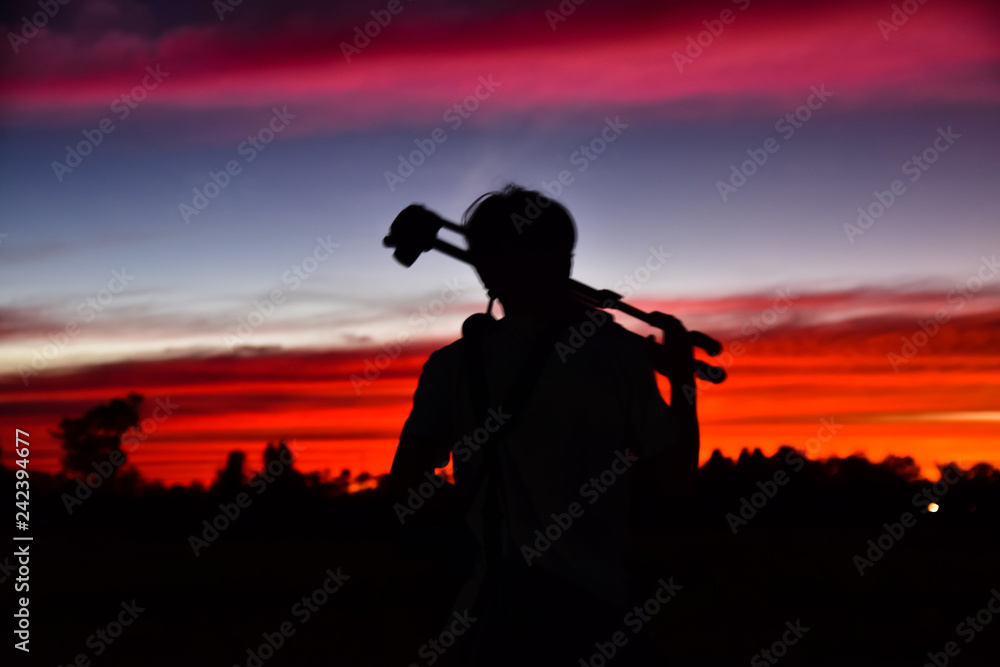 Blurry subject Silhouette man in sunset on evening