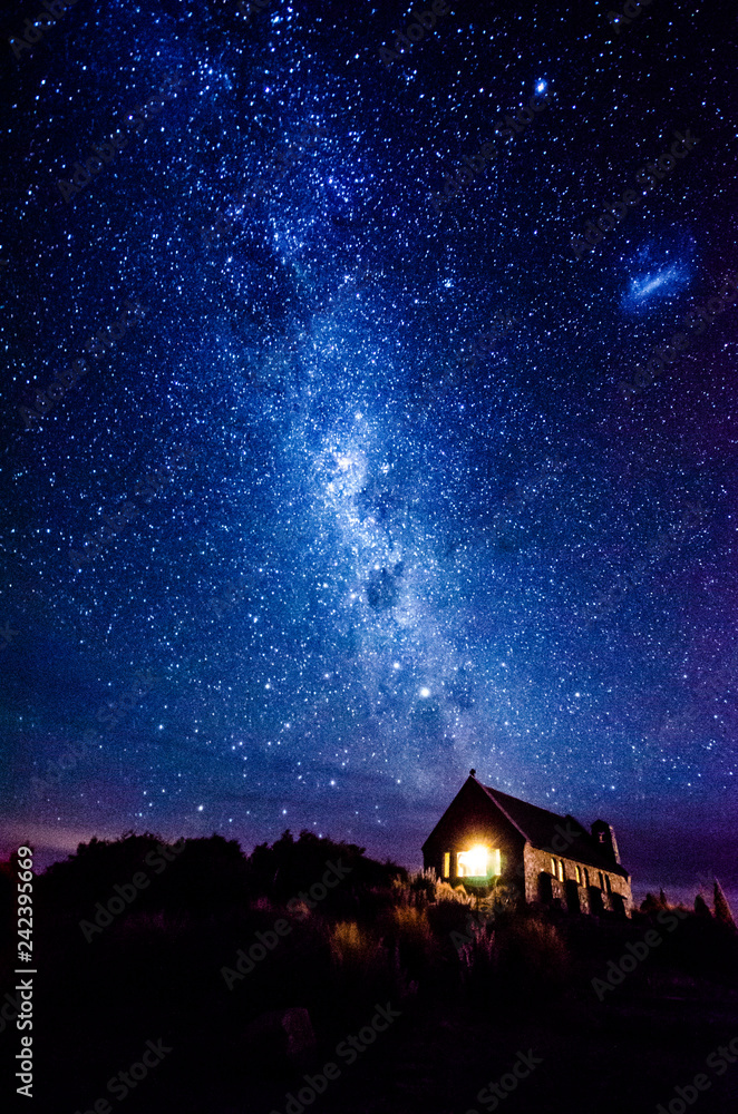Fototapeta premium Night sky over Good Shepherd's Chapel, Lake Tekapo, New Zealand