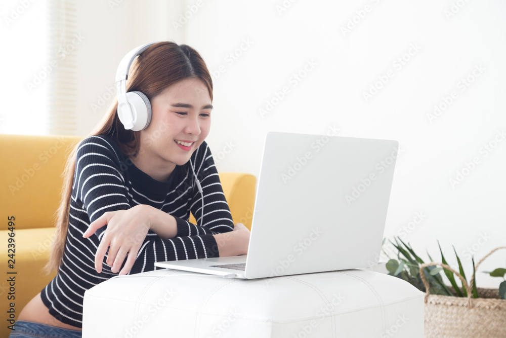 Asian young woman satisfied with learning language of online courses with laptop, Smiling female student listening and looking screen e-learning in notebook computer, Education technology concept Asian young woman satisfied with learning language of online courses with laptop, Smiling female student listening and looking screen e-learning in notebook computer, Education technology concept