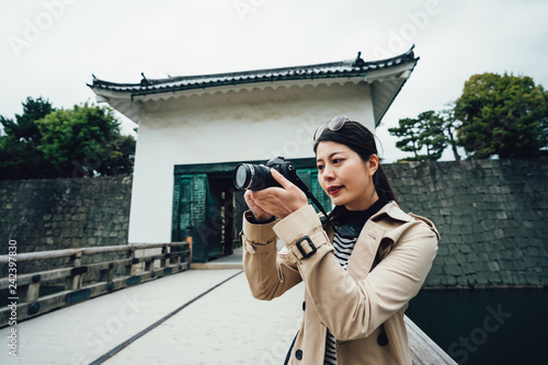 travel photographer stand on bridge nijo castle photo