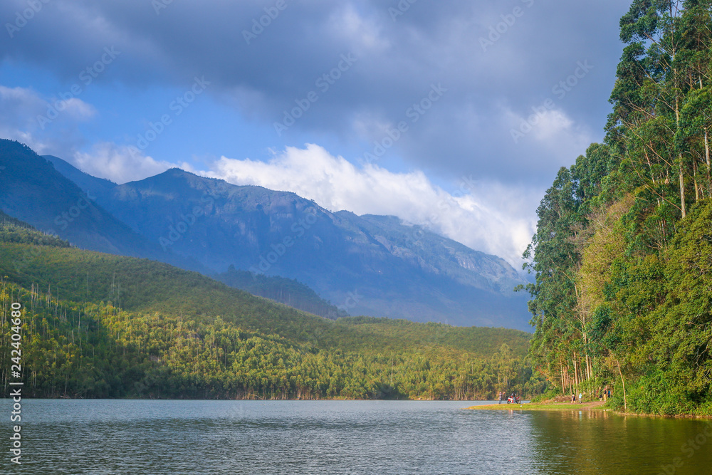lake at the center of mountain, river flows on mountain