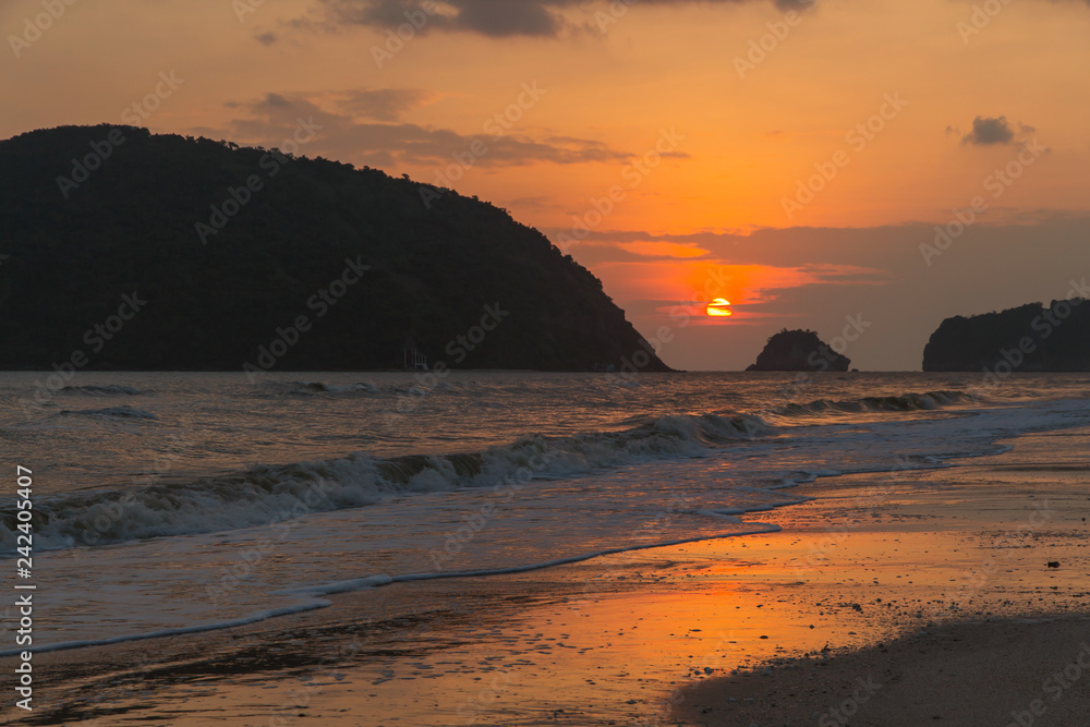 Sunrise landscape with orange sky on the sea with cloudy nature