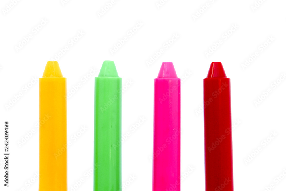 Crayon in plastic box arranged in rows isolated on white background. Crayon in plastic box arranged in rows isolated on white background.