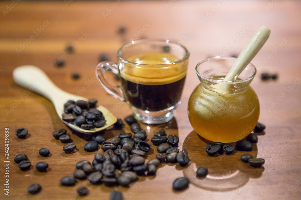 Honey jar and coffee cup and coffee beans Honey jar and coffee cup and coffee beans