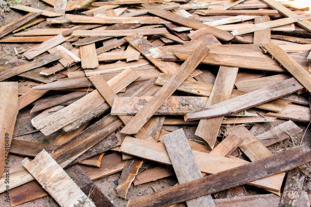 Old scattered boards or wood panels from demolition placed on the floor. Old scattered boards or wood panels from demolition placed on the floor.