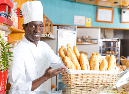 Bakery chef offering baked products