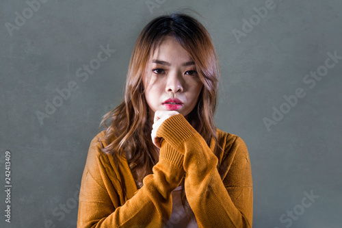 Obraz na plátně sad and desperate Asian Korean woman looking depressed feeling helpless and pain